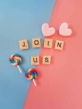 Bright 'Join Us' call-to-action with colorful lollipops and hearts on a pastel background.